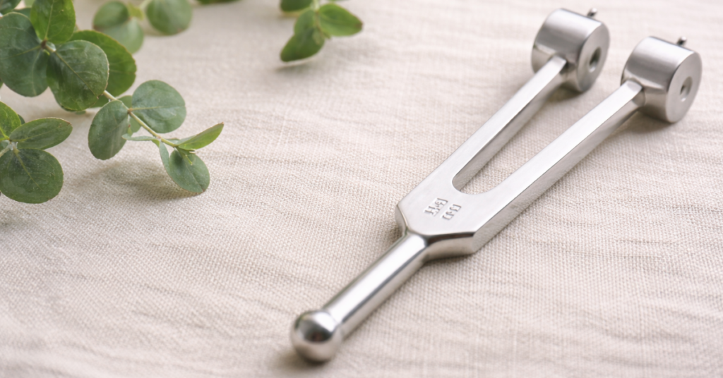 128 Hz weighted tuning fork benefits image for vibration therapy and nervous system support